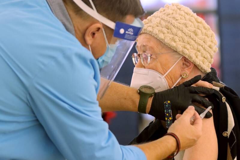 Margaret Havlis receives her first dose of the Moderna COVID-19 vaccine Tuesday, March 2, 2021, during a COVID-19 vaccination clinic through the McHenry County Department of Health at 1900 N. Richmond Road, the former site of a Kmart, in McHenry.  Vaccinations are made by appointment only.