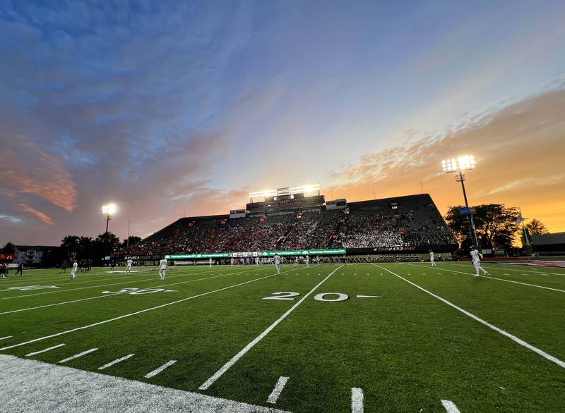 The sun sets during the DeKalb, Sycamore game Friday, Aug. 30, 2024, during the FNBO Challenge at Huskie Stadium at Northern Illinois University.