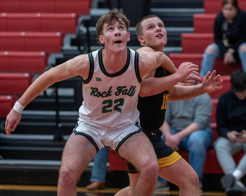 Owen Laws (22) of Rock Falls boxes out Traxton Mattingly (10) of Putnam County during the Colmone Classic on Monday, December 8, 2025 at Hall High School in Spring Valley.