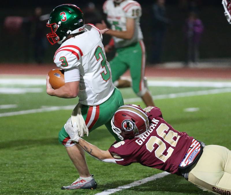 L-P's Mason Lynch (3) runs the football on a carry in the second quarter as Morris's Broc Grogan (26) brings him down during the Class 5A round one football game on Friday, Oct. 28, 2022 in Morris.
