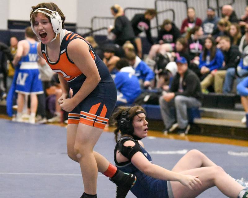 Makayla Hill of Oswego celebrates after pinning Lake Park’s wrestler Joscelin Ritthamel in the145-weight class championship match during the Aaron Dundley invite held at Oswego East High School.
