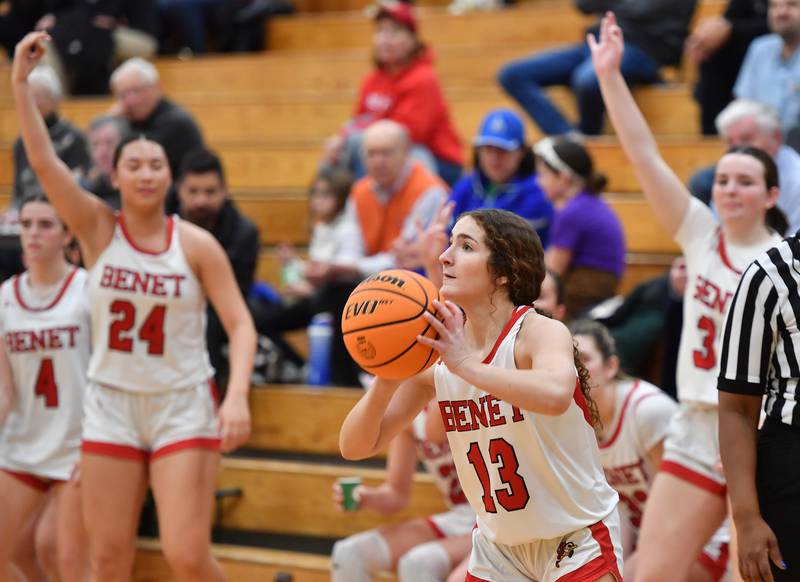 Benet’s Macy Menendez (13) takes aim for her second three pointer in quick succession just after coming off the bench during a game on January 8, 2025 at Benet Academy in Lisle.