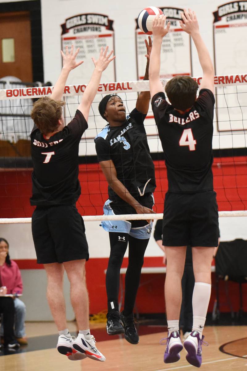 Kankakee's Jamon Barlow, center, looks to place a hit past Bradley-Bourbonnais' Trent Evans, left, and Cooper Yuska during a game at Bradley-Bourbonnais Thursday, April 9, 2026.