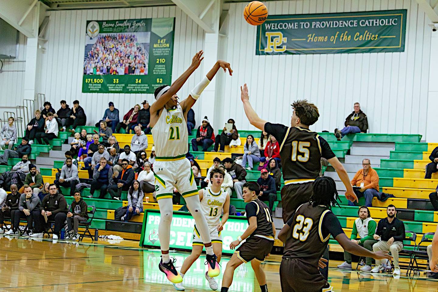 Providence's Jade Wyett (left) shoots over JCA's Brady Tunkel in Saturday's game.