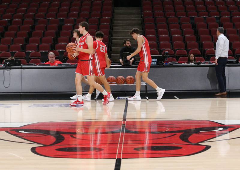 Members of the Streator boys basketball team warm up during a game against Seneca on Tuesday, Dec. 21, 2023 at the United Center in Chicago.