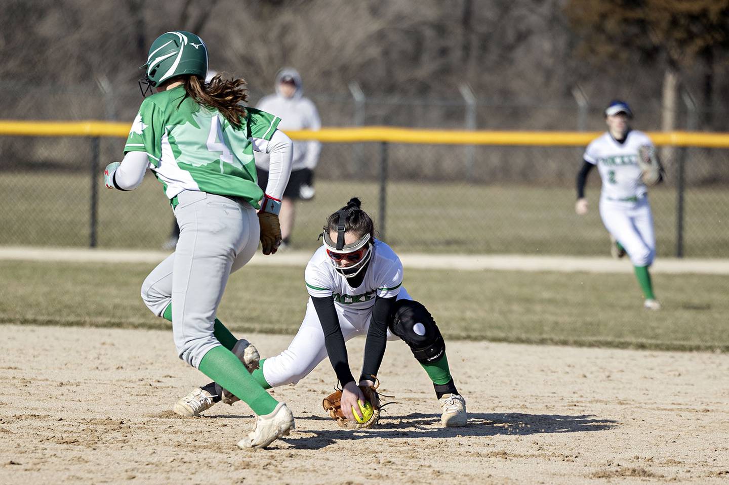 Rock Falls’ Maddison Morgan scoops up a grounder at second base for an out against Geneseo Wednesday March 29, 2023.