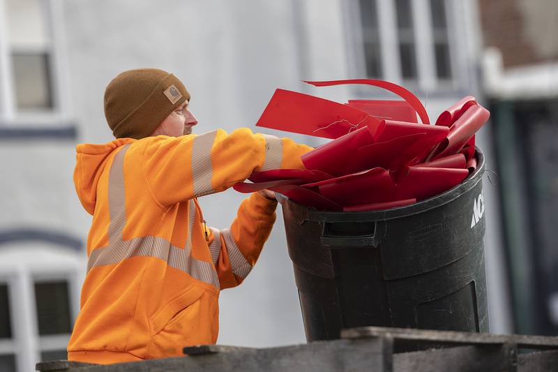 Josh Carr organizes bows Wednesday, Nov. 20, 2024, as the city of Dixon dresses up for the holidays.