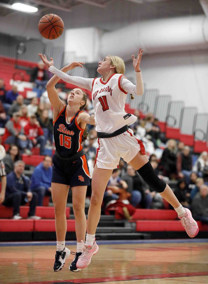 Buffalo Grove's Paige Veller (left) battles Huntley's Anna Campanelli for a rebound during the opening round of the Dundee-Crown High School 39th Annual Komaromy Classic girls basketball tournament Monday December 26, 2022 in Carpentersville.