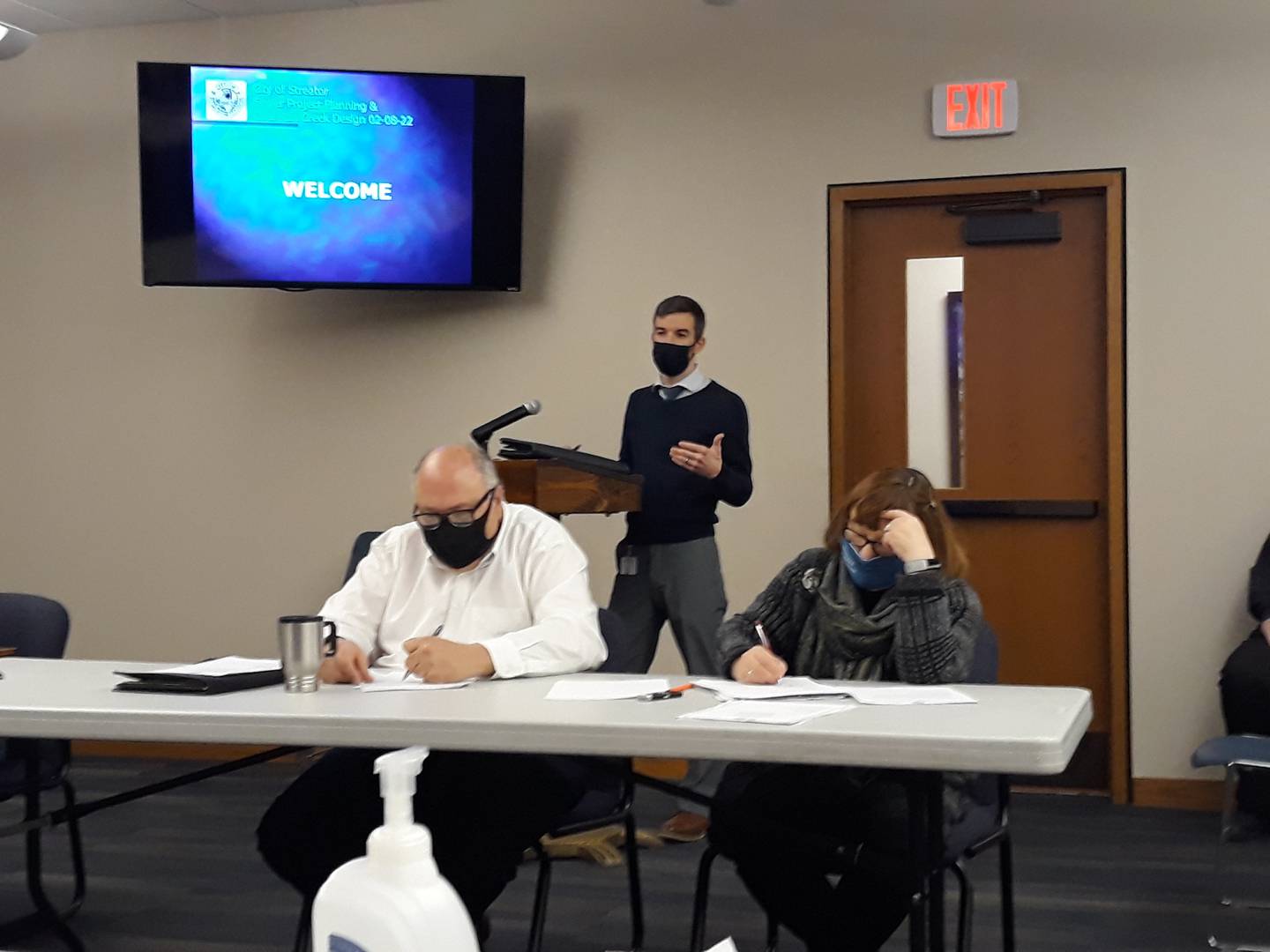 Tim Beccue, vice president of finance at Advanced Medical Transport, requested the Streator City Council contribute money to the ambulance service to keep it viable within the city. City Manager David Plyman (seated, left) and City Clerk Patricia Henderson listen in.