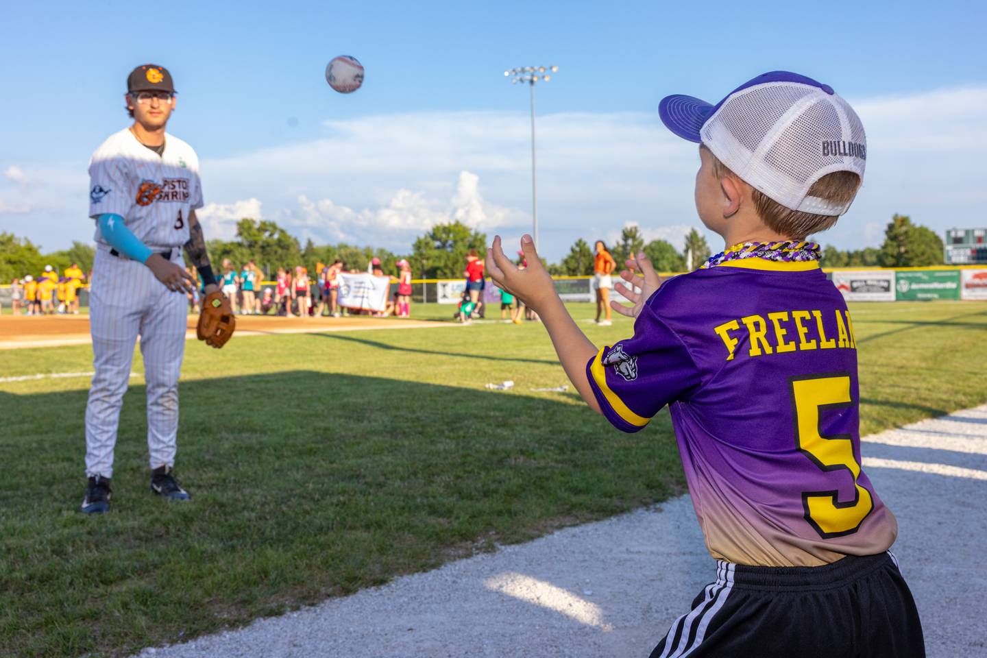 Pistol Shrimp athlete James Love plays catch with Wyatt Freeland prior to the start of the Pistol Shrimp game at Schweickert Stadium on July 15, 2025 in Peru.