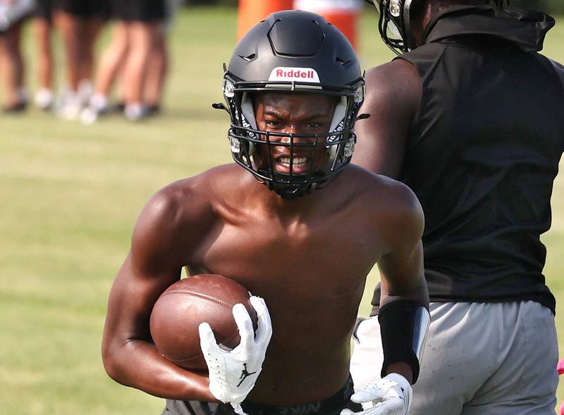 DeKalb’s Derrion Straughter runs the ball after a catch Tuesday, July 16, 2024, during their matchup with Woodstock North in the Kaneland 7-on-7 at the school in Maple Park.