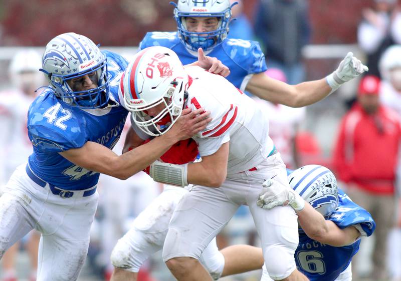 Woodstock’s Zachary Canaday, left, closes in on Ottawa’s Weston Averkamp in varsity football at Larry Dale Field on the campus of Woodstock High School Saturday.