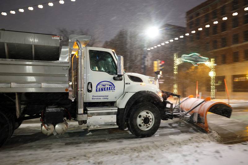 A city of Kankakee snow plow clears accumulated snow on South Schuyler Avenue on Saturday, Nov. 29, evening as flurries fell most of the day.