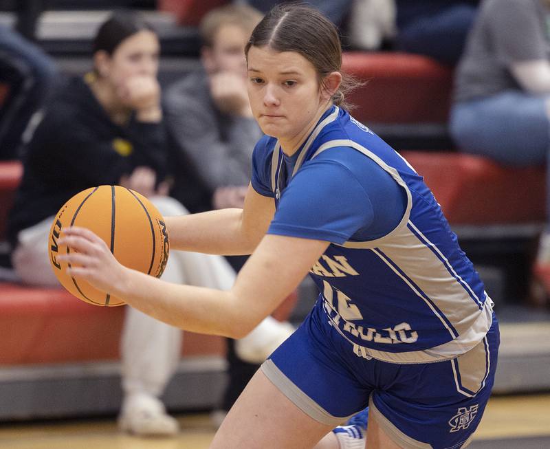 Newman’s Lucy Oetting drives to the hoop against River Ridge Thursday, Feb. 20, 2025, during the Class 1A girls basketball regional at Forreston.