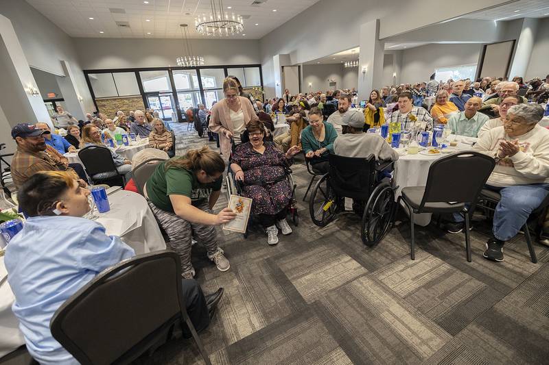 Pam Grozny is all smiles after being named the winner of the Suzy Hopper Wheelchair award winner Thursday, Oct. 17, 2024, at the Self Help client awards banquet.