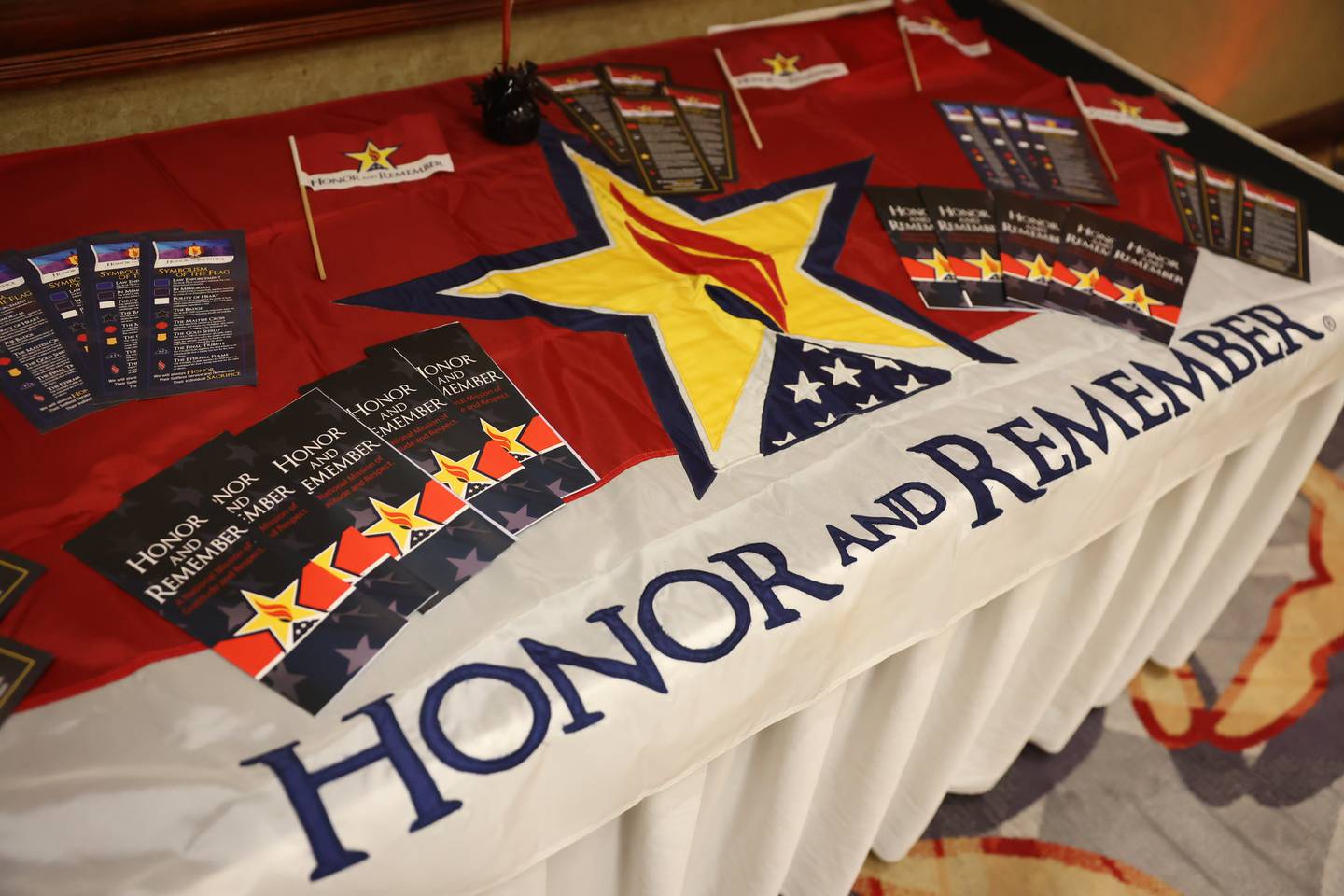 Denise Carson, an Army veteran and an ambassador for Honor and Remember, set up a table for the Honor and Remember organization at the Salute to Armed Forces event at the Double Tree in Alsip on Wednesday, Oct. 11, 2023. Honor and Remember focuses on the recognition of the militaries fallen heroes and their families.