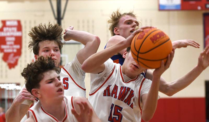 Oregon's Brian Wallace (15) rebounds with two of his teammates during action against Genoa-Kingston on Friday, Jan. 30, 2026 at the Blackhawk Center.