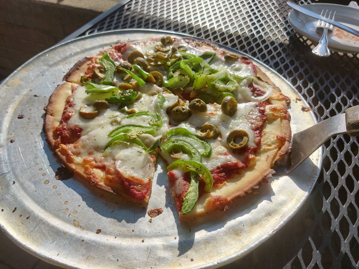 Gluten-free pizza with green pepper, onion and green olives at Pal Joey's in downtown Batavia.