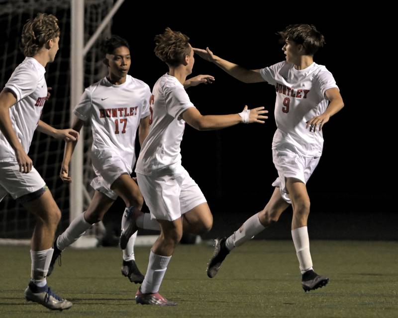 Huntley’s Anthony Frelas looks back to confirm his goal against Hampshire in an IHSA Class 3A boys soccer sectional semifinal game in Streamwood on Oct. 30, 2024.