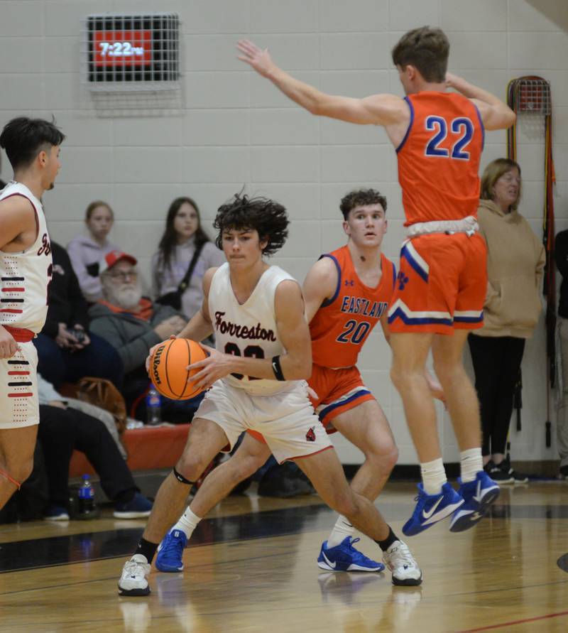 Forreston's Jonathan Milnes (32) looks to pass as Eastland's Braden Anderson (22) and Peyton Spears (20) defend on Saturday, Jan. 4, 2025 at Forreston High School.