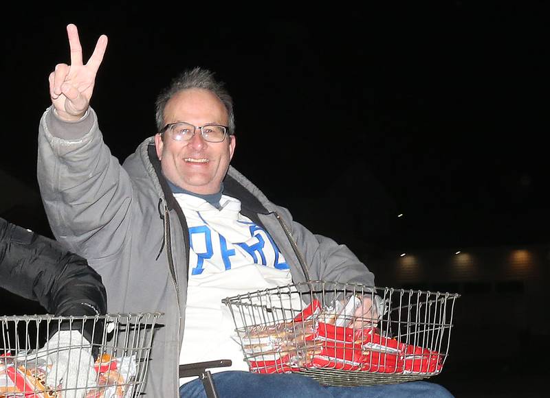 Peru mayor Ken Kolowski rides on a float during the annual Christmas Parade on Saturday, Dec. 7, 2024 on Peoria Street in Peru.