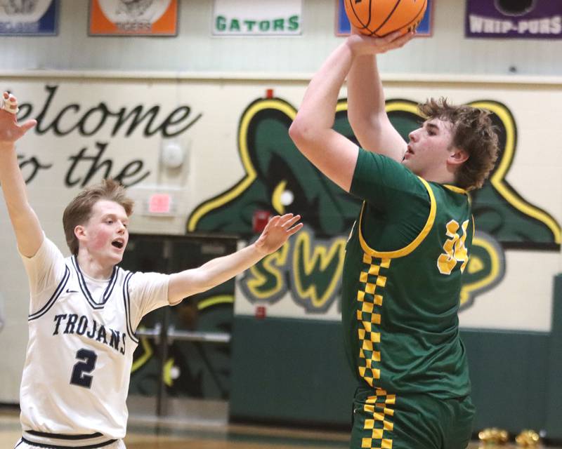 Crystal Lake South’s John Morgan drains an outside shot as Cary-Grove’s AJ Berndt defends  in boys IHSA Class 3A Regional Championship basketball on Friday, Feb. 27, 2026, at Crystal Lake South High School in Crystal Lake.