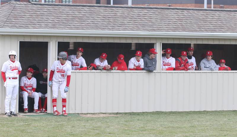 Members of the Ottawa baseball team root on the Pirates as they play Serena last season at Ottawa High School.