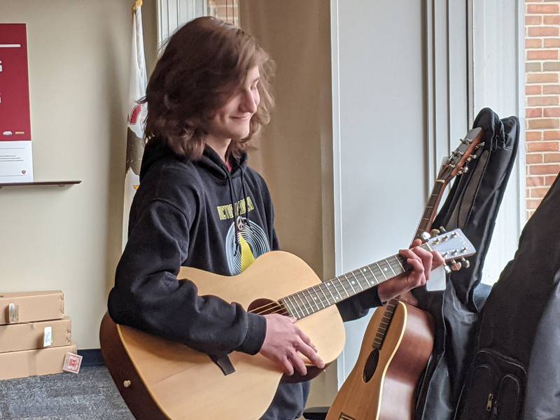 Owen Meiring is the first recipient of the Michael Heaton musical scholarship, which was created last year to honor Heaton, a 1985 Batavia High School graduate. Heaton, a Montgomery resident, died in December 2019 after a battle with cancer. On Monday, Meiring was presented with a new guitar as part of the scholarship. He will also receive a year of guitar and songwriting lessons.