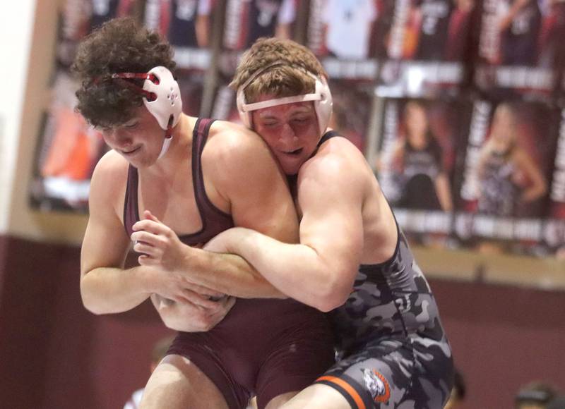 McHenry’s Henry Mitchell, right, battles Prairie Ridge’s Frank Matviychuk at 215 pounds in varsity boys wrestling on Thursday, Jan. 8, 2026 at Prairie Ridge High School in Crystal Lake.