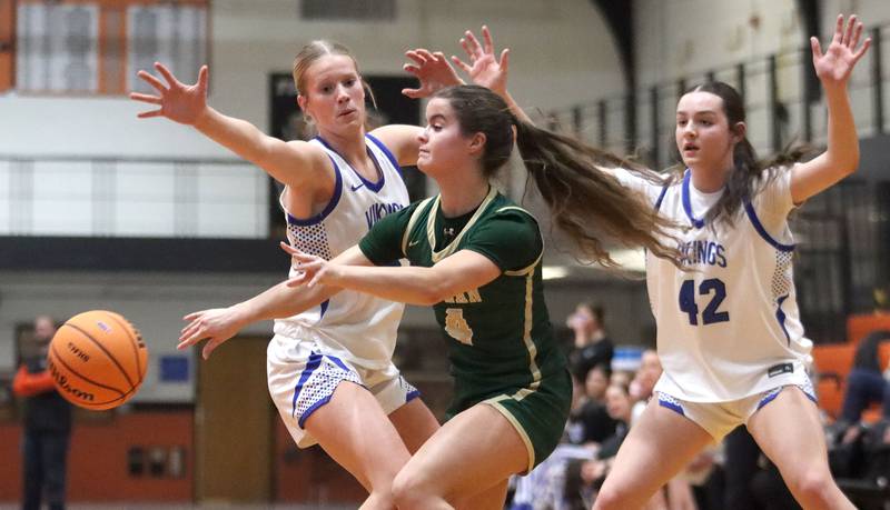 Boylan’s Emme Hernandez, center, passes as Geneva’s Emma Peterson, left, and Adelyn Estabrook defend in girls IHSA Class 3A Sectional basketball on Tuesday, Feb. 24, 2026, at Crystal Lake Central High School in Crystal Lake.
