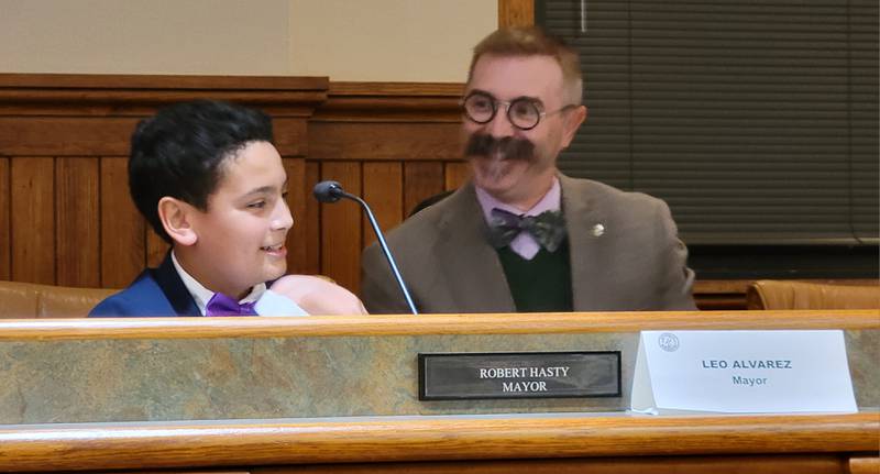 Leo Alvarez shares a light moment with his predecessor for a night, Ottawa Mayor Robb Hasty, during Tuesday night's Kiwanis Kids Council meeting at City Hall.