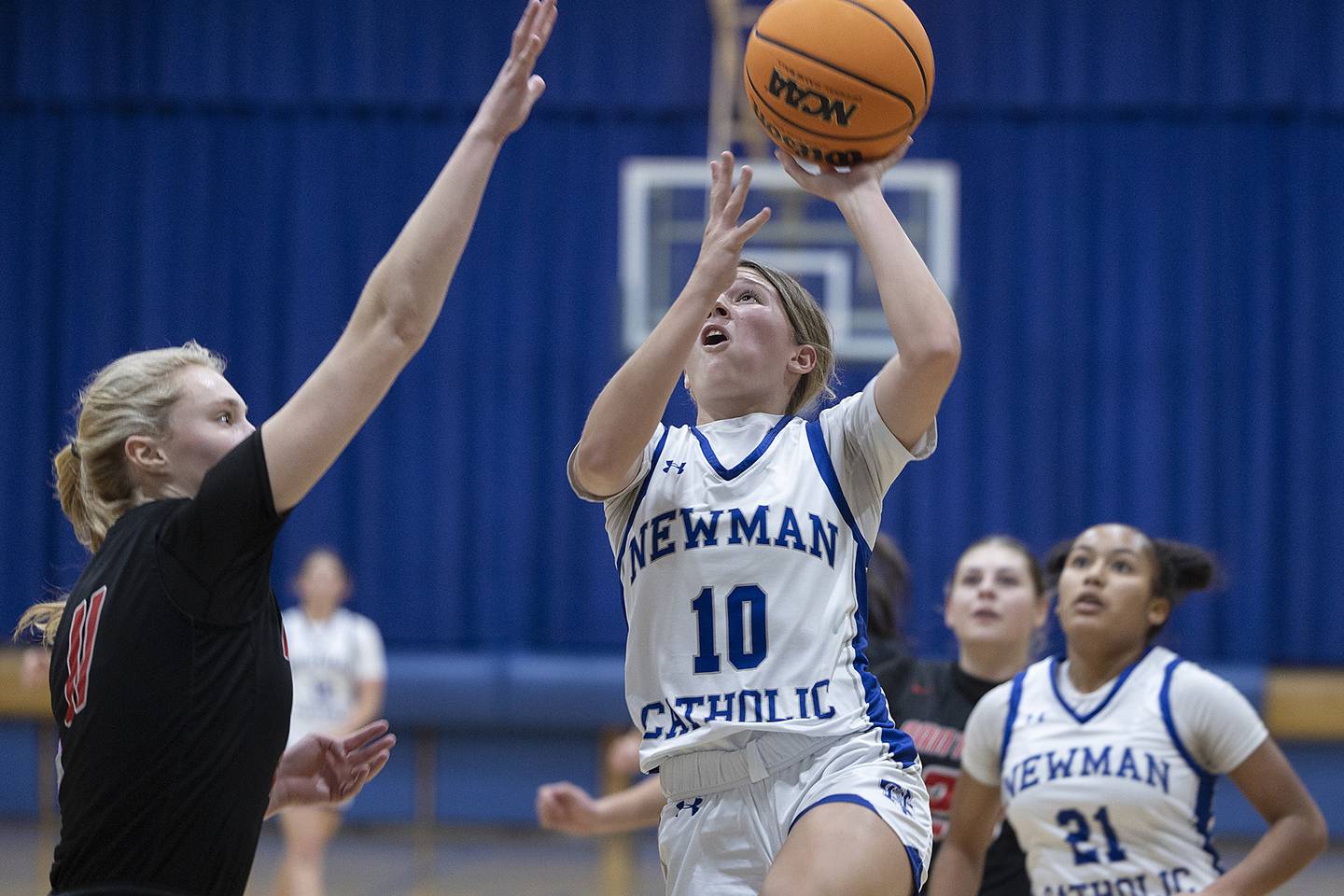 Newman’s Elaina Allen puts up a shot against Erie-Prophetstown’s Lauren Abbott Thursday, Dec. 12, 2024, at Newman High School.
