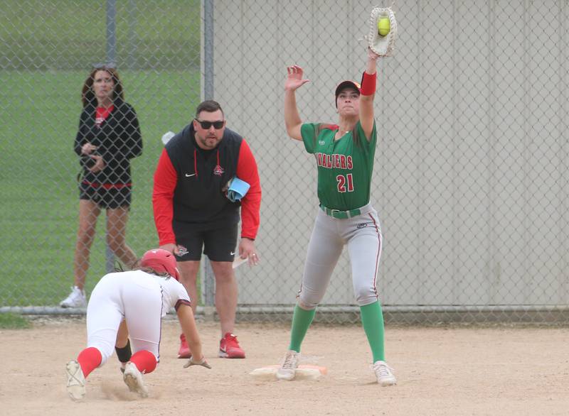 L-P's Anna Riva squeezes the ball in her glove to force out Ottawa's Annamarie Corsolini after diving back to first base on Wednesday, May 7, 2025 at Ottawa High School.