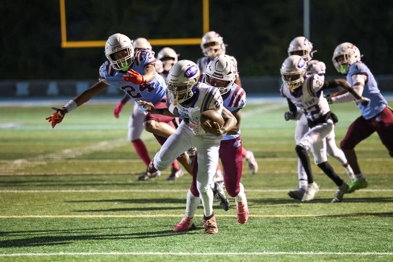 Kankakee's Jacaree Chandler tackeles Bloom's Carmello Whitehorn for a loss during the Kay's victory over Bloom on Friday, Oct. 10, 2025.
