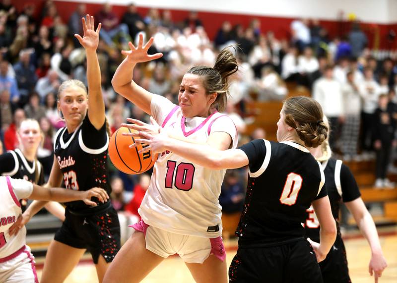 Batavia's Payton Haslett has her shot blocked by St. Charles East's Kathlyn Bainbridge (right) during a game on Thursday, Feb. 6, 2025 in Batavia.