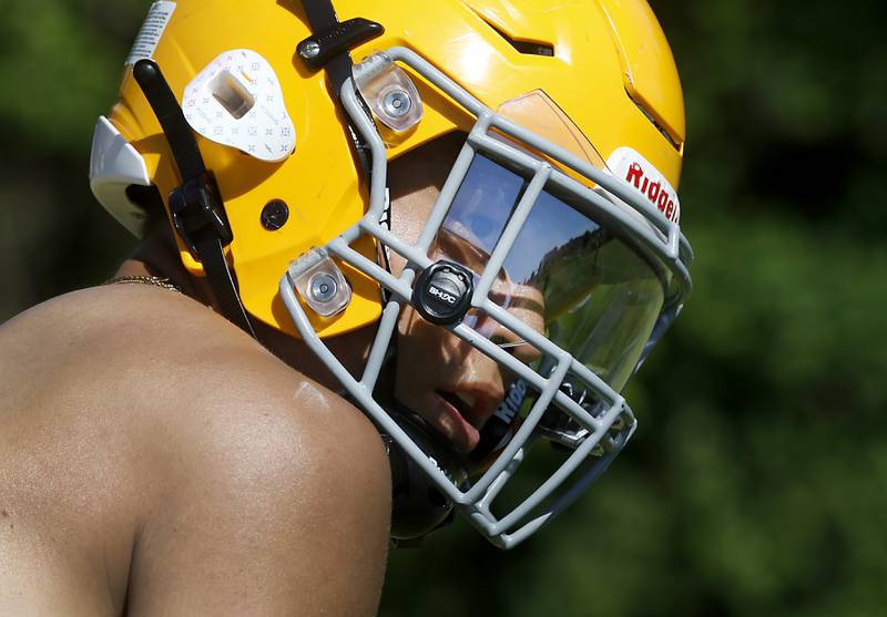 Kevin True looks towards the quarterback before running a route during football practice Monday, June 20, 2022, at Jacobs High School in Algonquin.