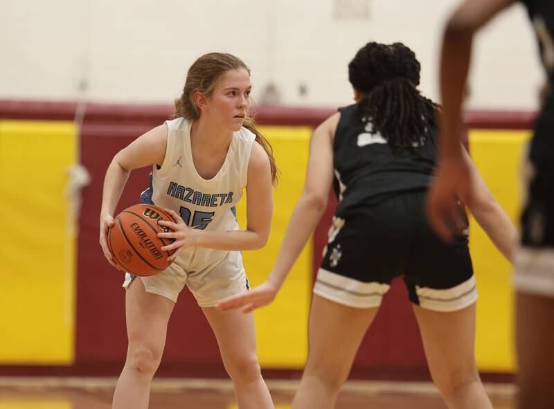 Nazareth's Mary Bridget Wilson looks for an outlet (15) during the girls 3A varsity super-sectional game between Nazareth Academy and Fenwick High School in River Forest on Monday, Feb. 27, 2023.