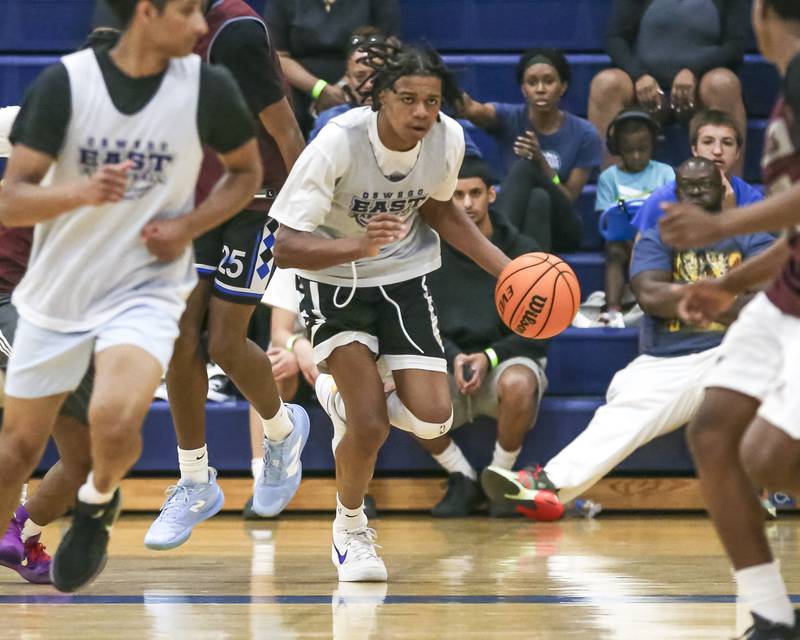 Oswego East's Mason Lockett (12) races down the court  in their Riverside-Brookfield Shootout basketball game.  June 20, 2025 in Riverside.