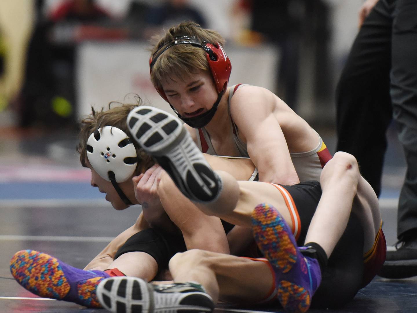 Schaumburg’s Callen Kirchner, right, wrestles DeKalb’s Rory Burright in a 113-pound match during the semifinals of the Conant wrestling sectional in Hoffman Estates Saturday.