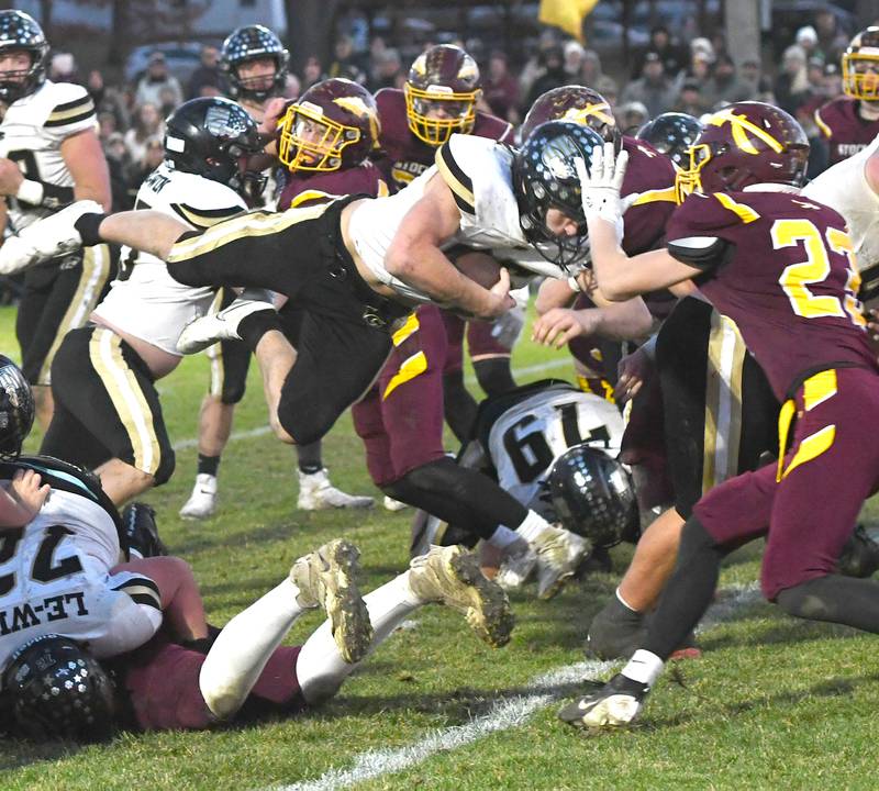 Lena-Winslow's Aiden Wild (85) dives over the goal line for a touchdown against Stockton in 1A semifinal action in Stockton on Saturday, Nov. 22, 2025.