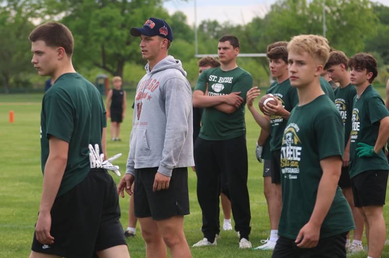 Chicago Bears quarterback Tyson Bagent watches high school students catch passes during the Tyson Bagent Offensive Skills Camp on Saturday, May 23, 2026 at St Bede Academy.