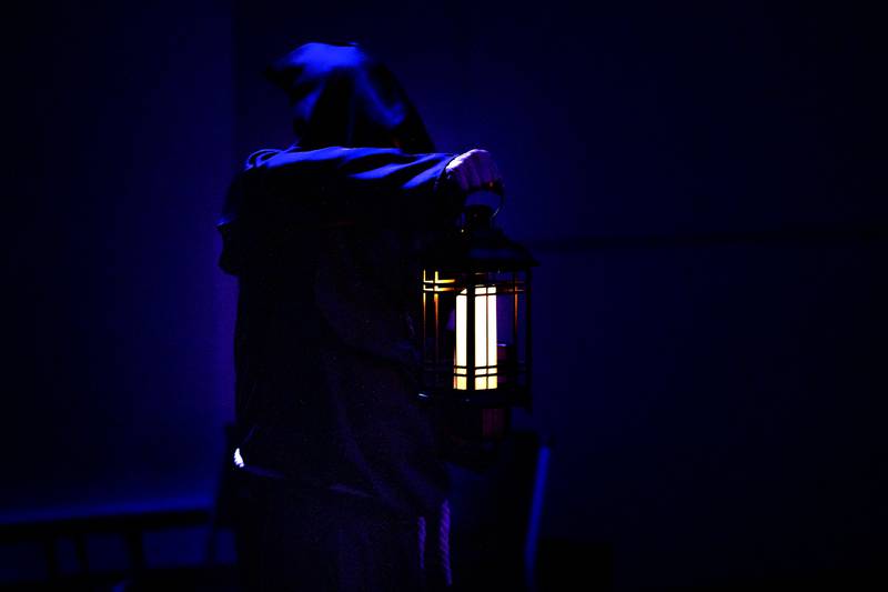 The Scribe, Larry Ubben, enters the theater at the start of rehearsal for PAG’s “Tapestry of Shadows,” Tuesday, Oct. 7, 2025.