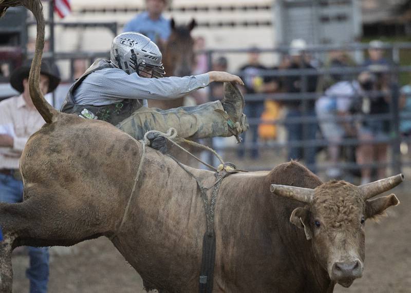 Perry Schrock gets bucked off his bull Tuesday, August 15, 2023 in the Next Level Pro Bull Riding event at the Whiteside County Fair.