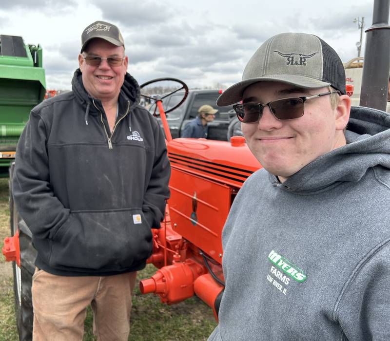 Dave and Justin Myers, of Leaf River Farms in Adeline, stand by their 1949 Case tractor on Saturday, April 5, 2025 at the Hazelhurst Spring Consignment Auction west of Polo. The tractor was restored by Forreston FFA members and won by Dave in a raffle last year. He decided to sell the tractor at the auction and donate the proceeds back to the Forreston FFA.
