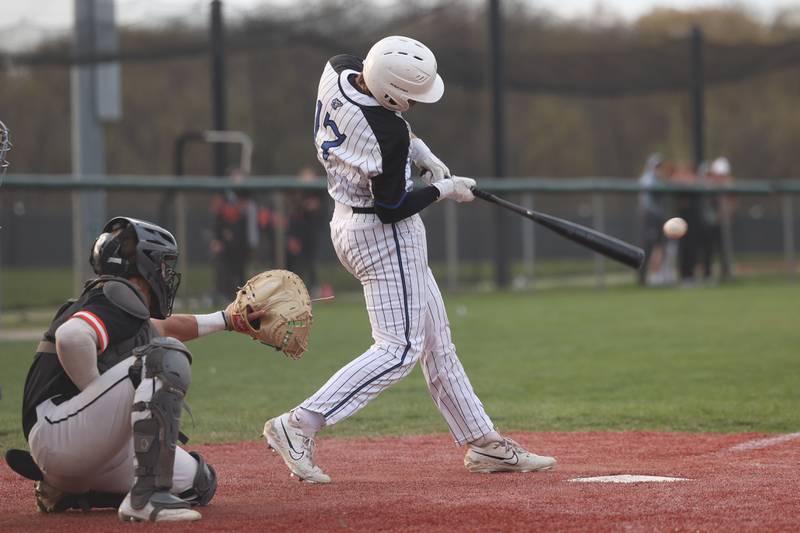 Lincoln-Way East’s Aiden Knipper connects for a walk-off single against Lincoln-Way West in the Griffins 3-2 win on Monday, April 24, 2023 in Frankfort.