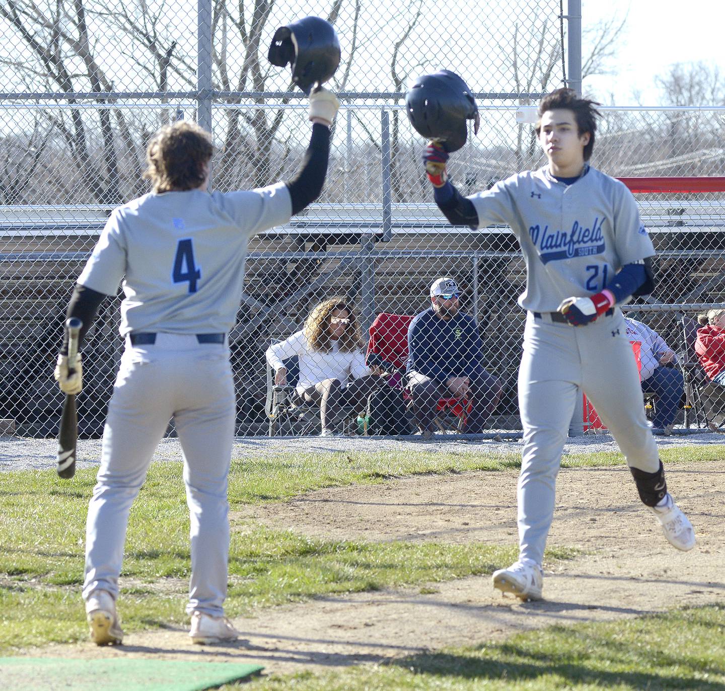 Plainfield’s Evan Carey (4) awaits Blake Pommachannom as he crosses home after belting a home run in the first inning against Streator on Tuesday at Streator.