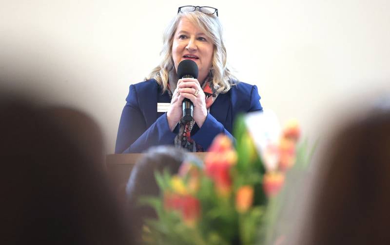 Resource Bank President and Chief Executive Officer Diana Shott accepts the Sycamore Chamber of Commerce Outstanding Business of the Year Award on behalf of the bank during the 106th Annual Chamber Meeting Thursday, March 2, 2023, in Memorial Hall at St. Mary's Catholic Church in Sycamore.