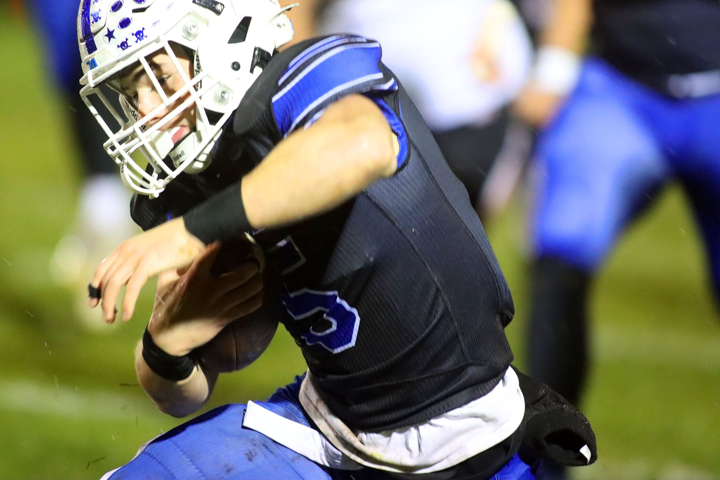 Burlington Central’s Parker Auxier moves the ball against Harlem in IHSA football Class 6A second-round playoff action at Central High School in Burlington on Saturday, November 8, 2025.