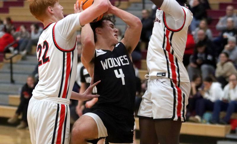 Prairie Ridge’s Luke Vanderwiel navigates heavy traffic in varsity boys basketball on Tuesday, Feb. 18, 2025, at  Huntley High School in Huntley.