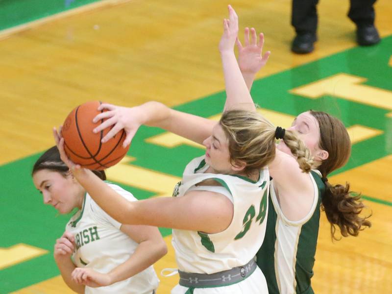 Seneca's Tessa Krull grabs a rebound over St. Bede's Lili McClain on Monday, Jan. 29, 2024 at Seneca High School.